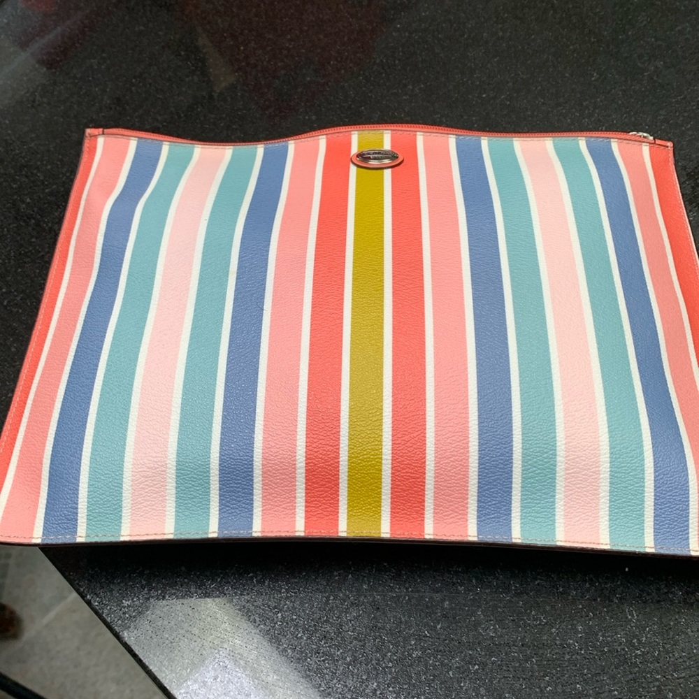 Coach multi color clutch. Zipper top closure with wide pocket inside.